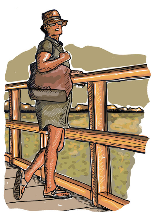 Une femme enceinte sur un pont
