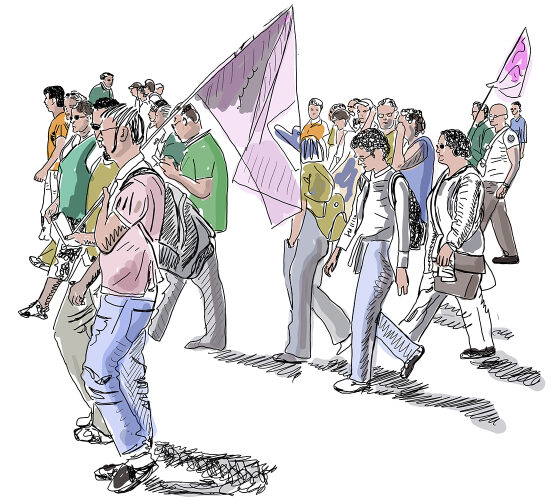 Un groupe de personnes marche dans une rue avec des drapeaux et des banderoles