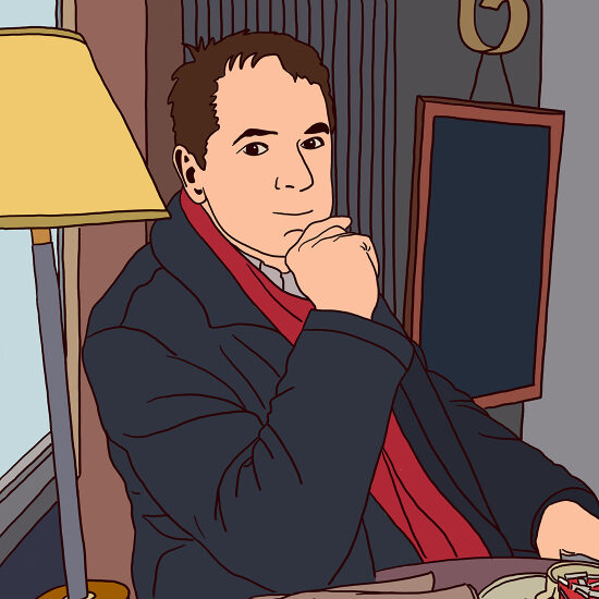 Un homme en noir et rouge, assis dans un bureau