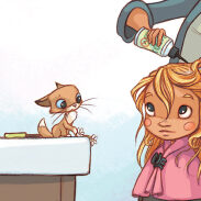 Fille se faisant coiffer avec un chat