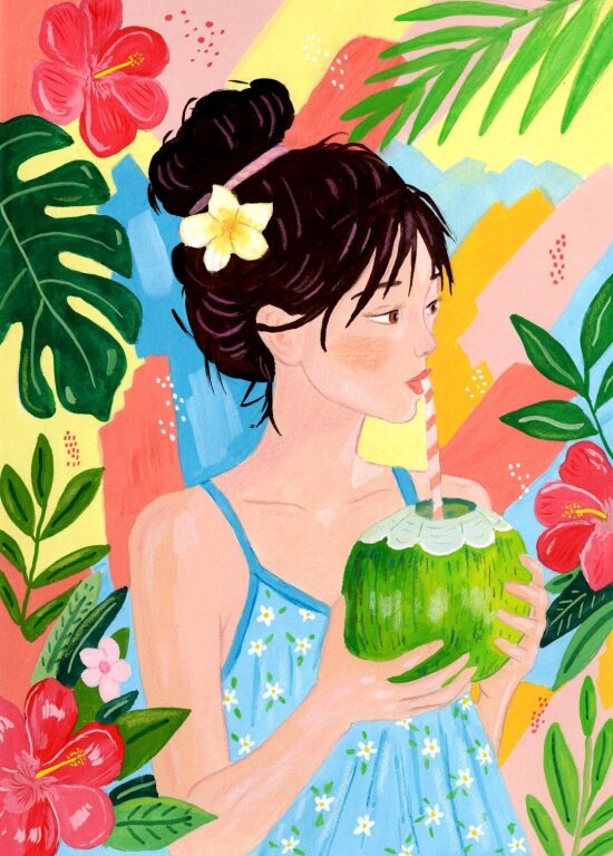 Femme tropicale tenant une noix de coco